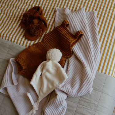 Barboteuse ocre en mérino 18-24M