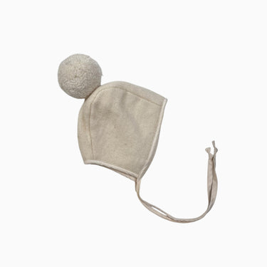 Bonnet en lainage crème pompon 6-12M
