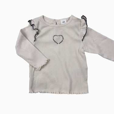 Chandail vanille avec volant 'Kindness always' cotelé 6-9M